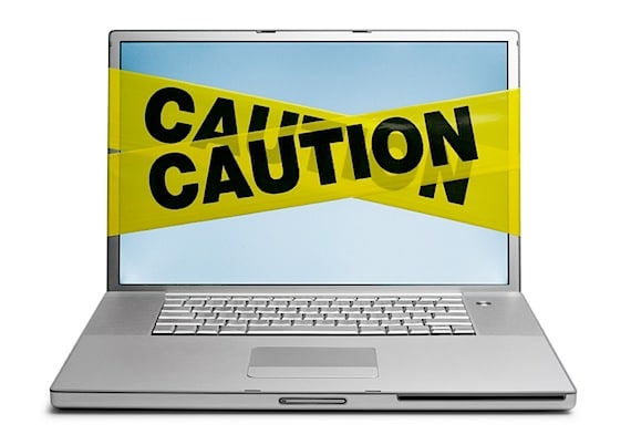 Warning Tape Wrapped Around Laptop - Photo courtesy of ©iStockphoto.com/DNY59, Image #1520756